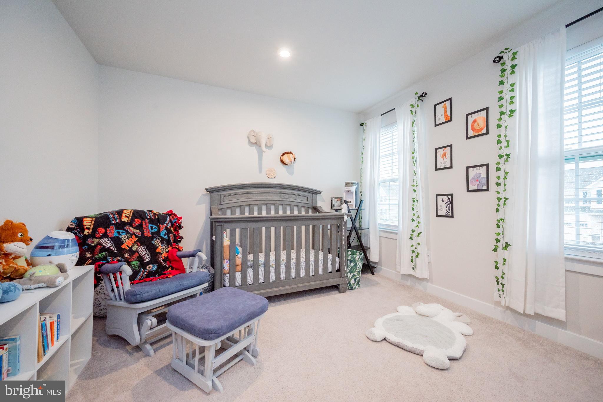 772 Wallasey Drive Middletown, DE 19709 - Photo 44 of 60 a bedroom with furniture and a baby crib