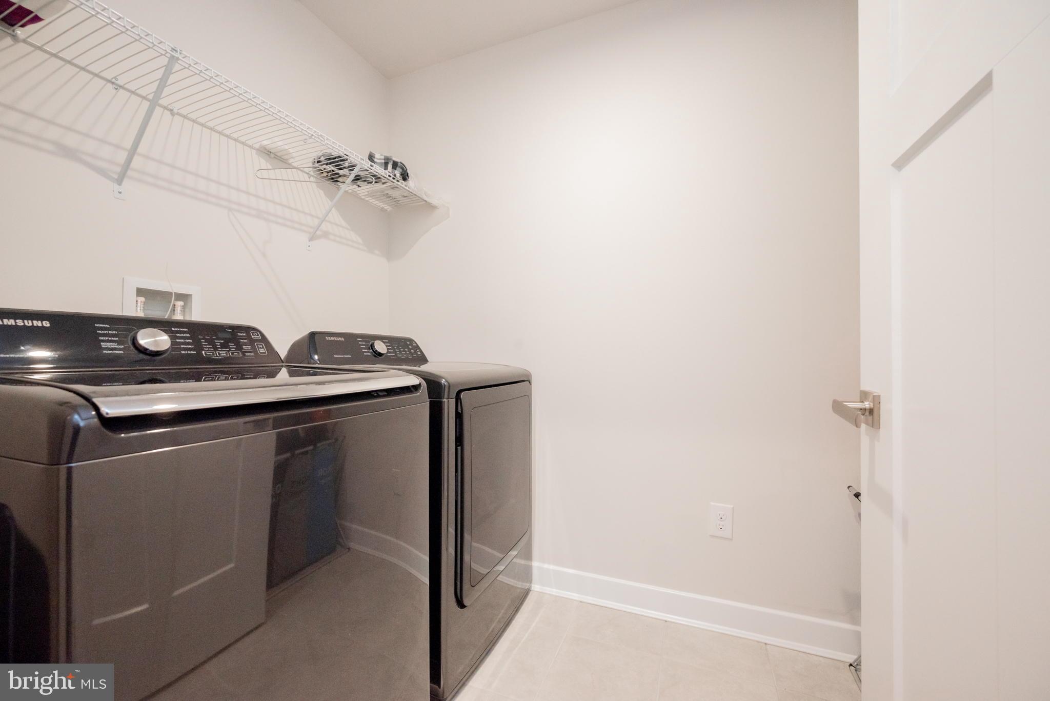772 Wallasey Drive Middletown, DE 19709 - Photo 46 of 60 a utility room with dryer and washer