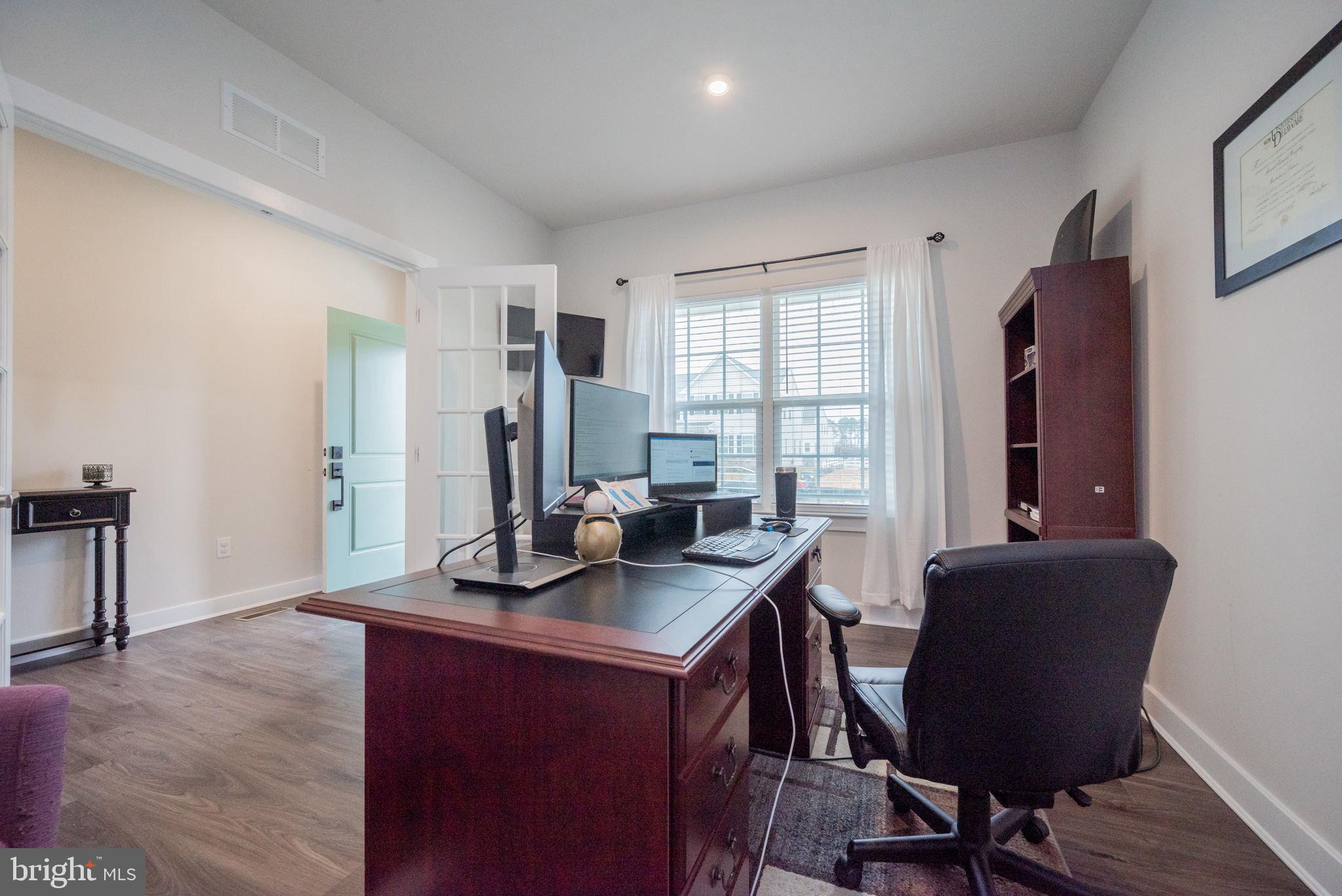 772 Wallasey Drive Middletown, DE 19709 - Photo 5 of 60 a view of a workspace with furniture and a window