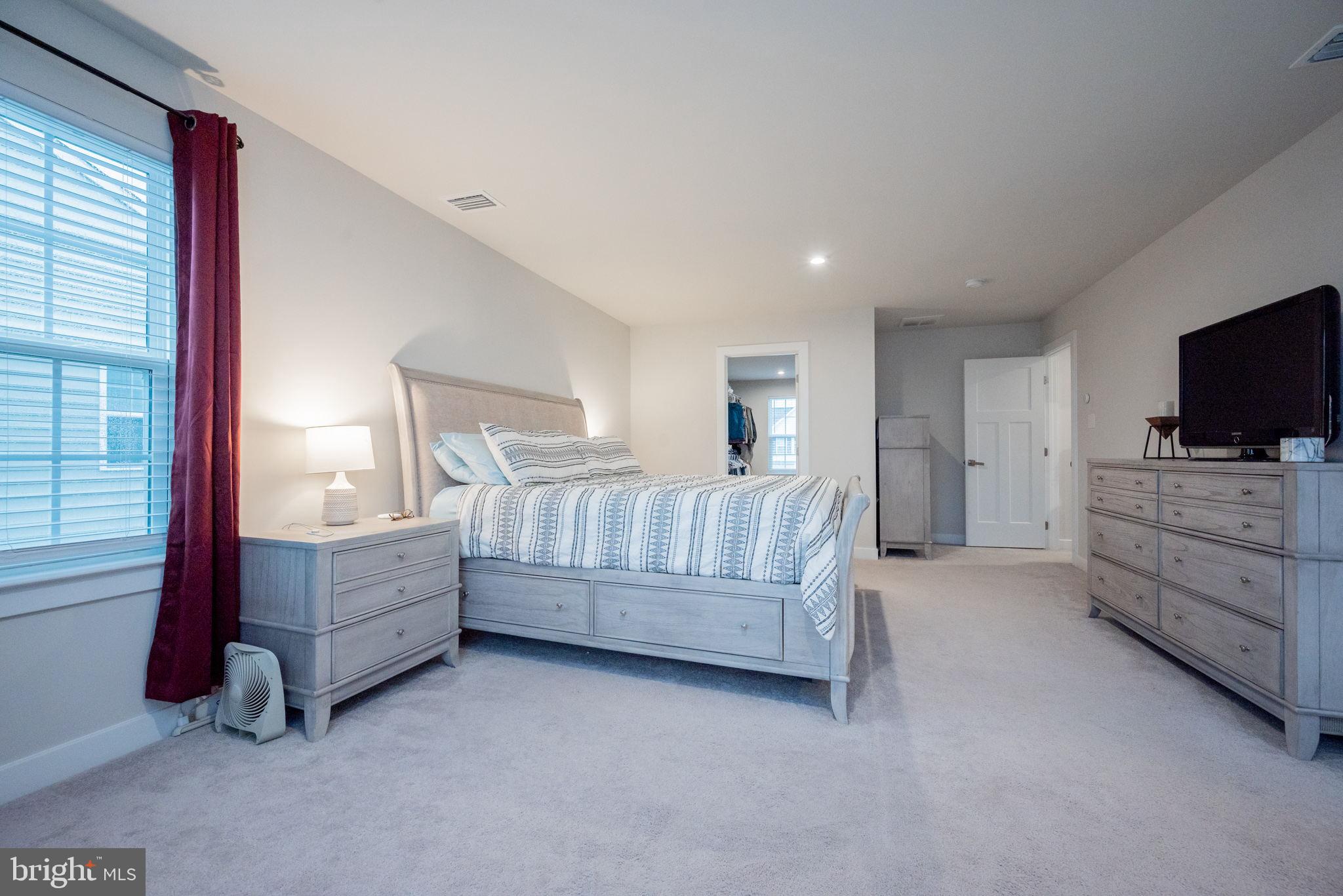 772 Wallasey Drive Middletown, DE 19709 - Photo 53 of 60 a bed room with furniture and flat screen tv