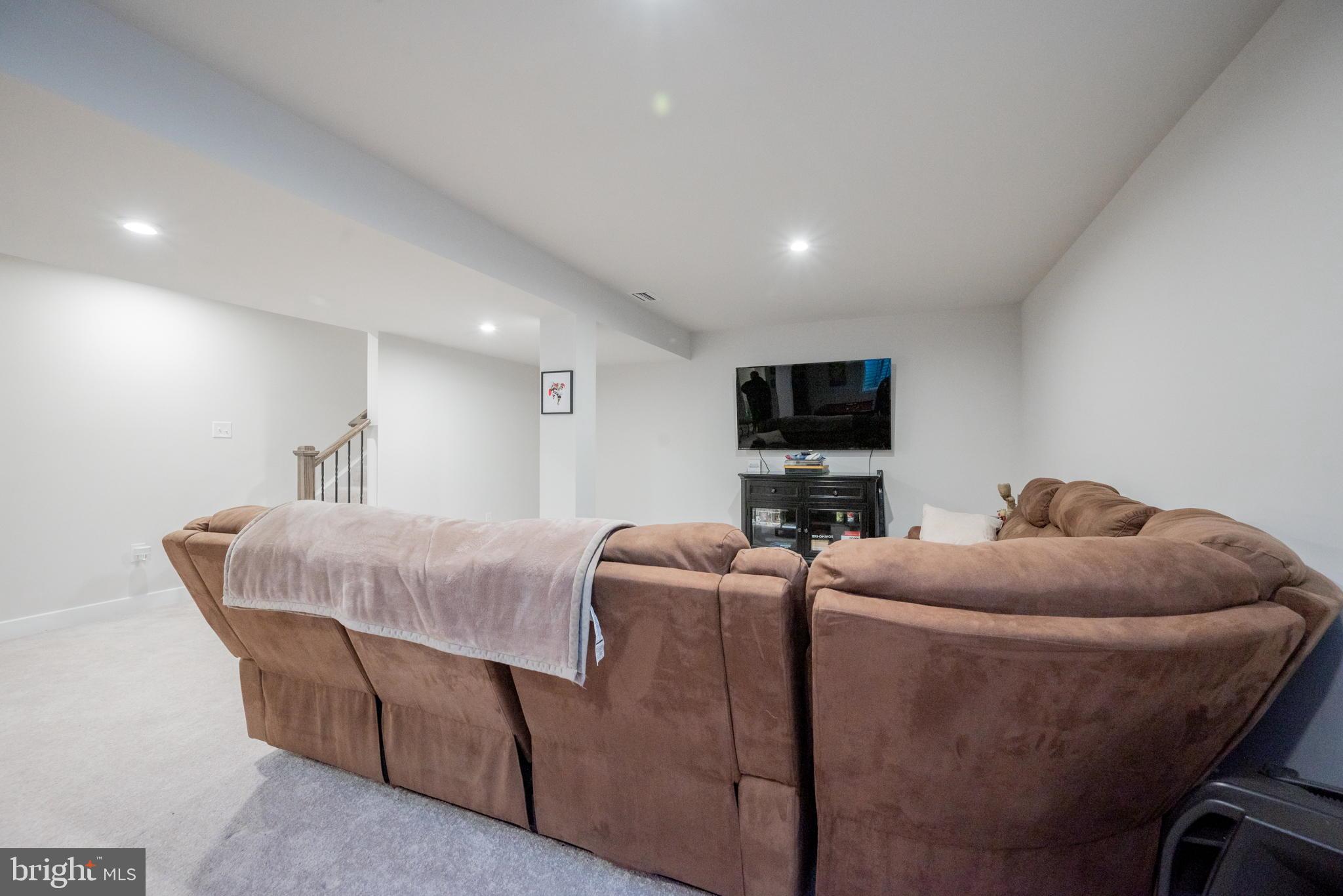 772 Wallasey Drive Middletown, DE 19709 - Photo 58 of 60 a living room with furniture and a flat screen tv