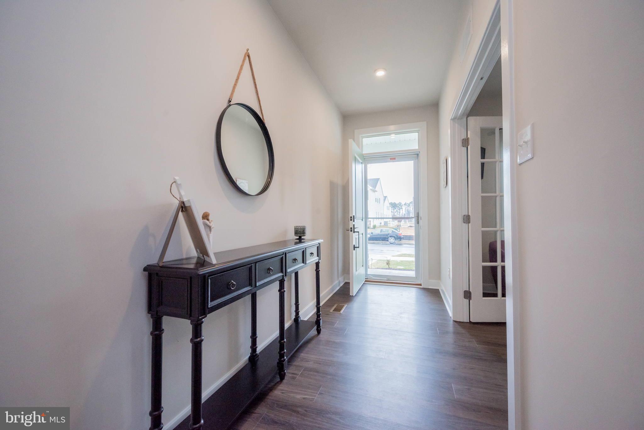 772 Wallasey Drive Middletown, DE 19709 - Photo 7 of 60 a view of a room with wooden floor and windows