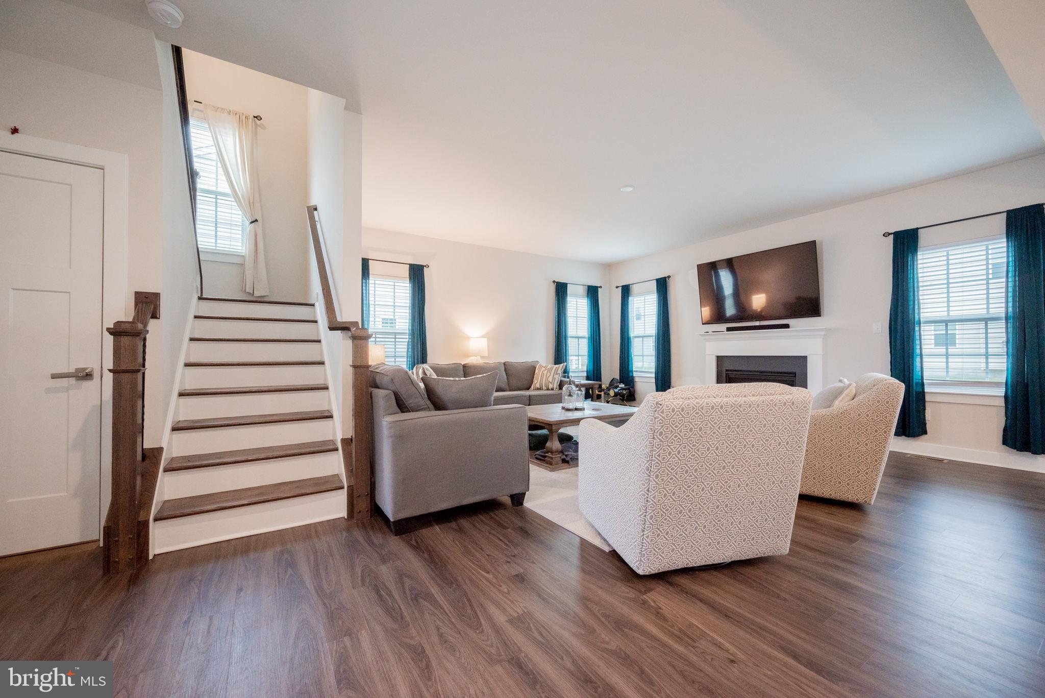 772 Wallasey Drive Middletown, DE 19709 - Photo 10 of 60 a living room with furniture and a flat screen tv