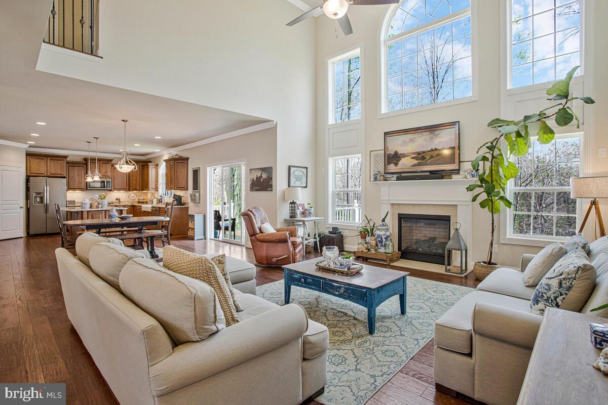 54 Simmons Ridge Road Prince Frederick, MD 20678 - Photo 14 of 55 a living room with furniture fireplace and a window