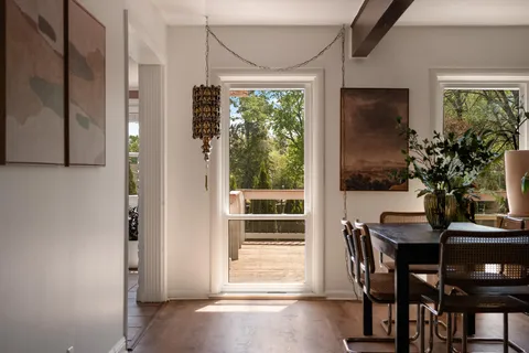 a view of a dining room with furniture window and outside view