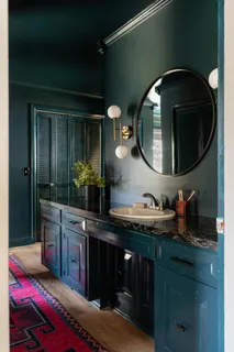 a bathroom with a double vanity sink and mirror