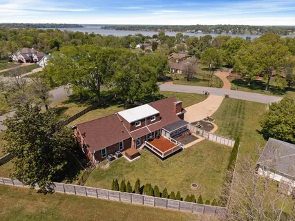 a front view of house with yard and outdoor seating