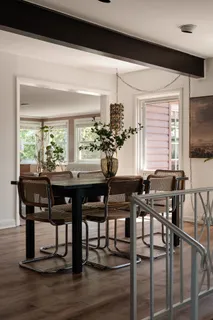 a view of a dining room with furniture and window