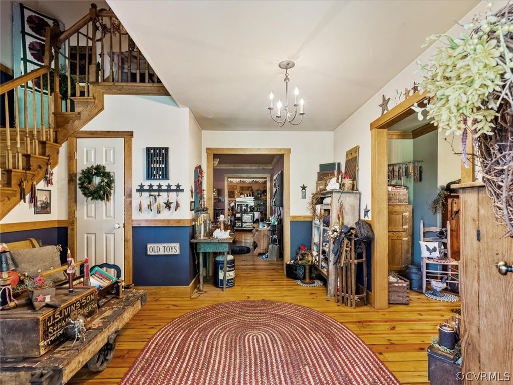 2430 Academy Road Powhatan, VA 23139 - Photo 8 of 43 Open foyer with pine floors and stairs tucked to s