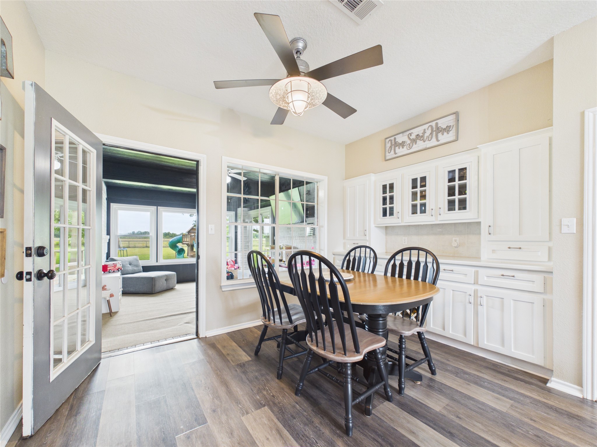 4610 Mustang Road Alvin, TX 77511 - Photo 25 of 50 Peek into the sunroom/playroom from the dining room.