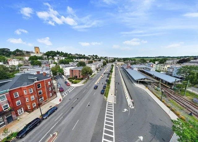 an aerial view of a house with a lake view