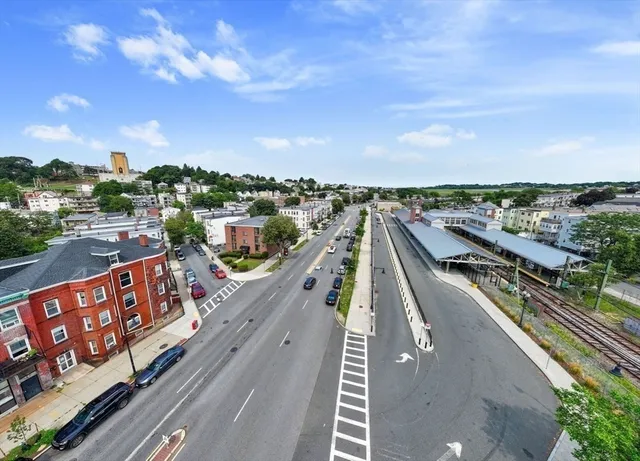 an aerial view of a house with a lake view