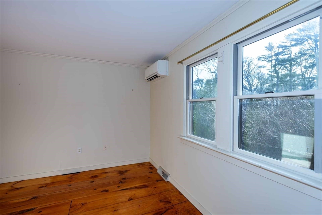 17 Chapman Lane Edgartown, MA 02539 - Photo 14 of 26 a view of a small space with wooden floor and a window