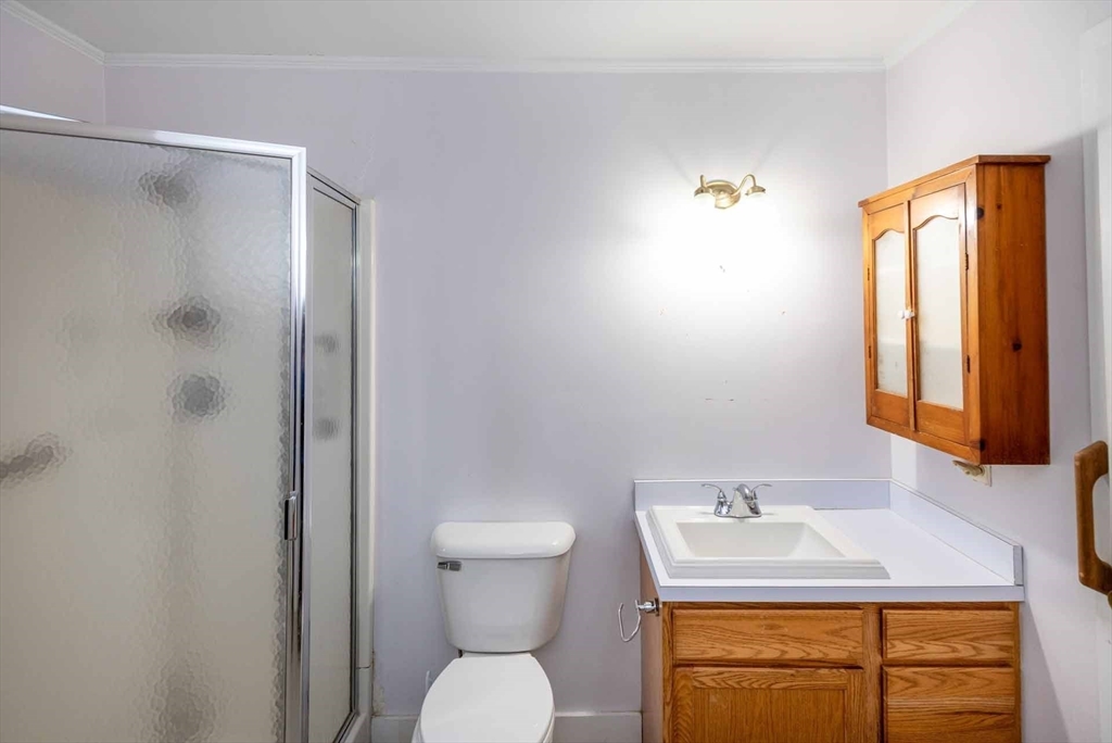 17 Chapman Lane Edgartown, MA 02539 - Photo 15 of 26 a bathroom with a sink toilet and shower