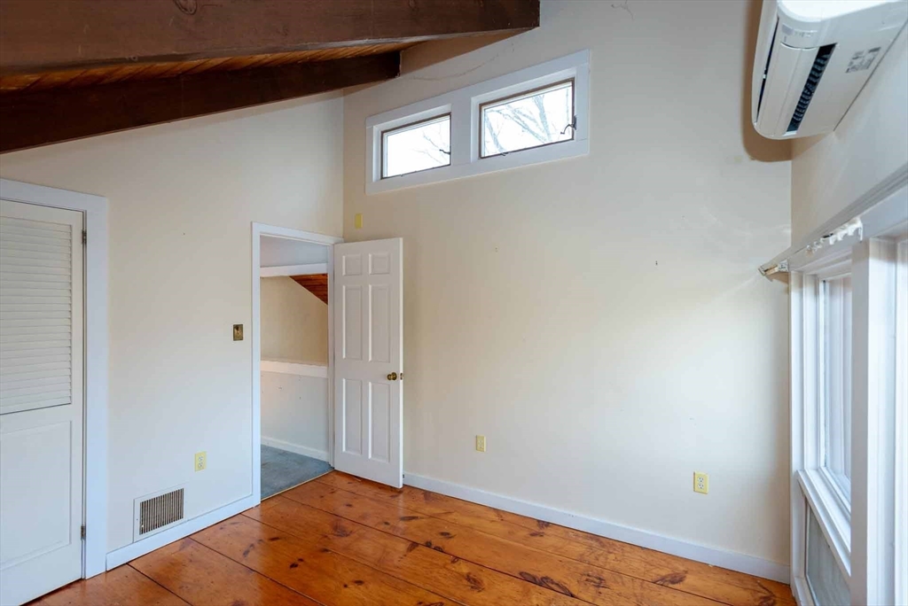 17 Chapman Lane Edgartown, MA 02539 - Photo 16 of 26 a view of room with window and wooden floor