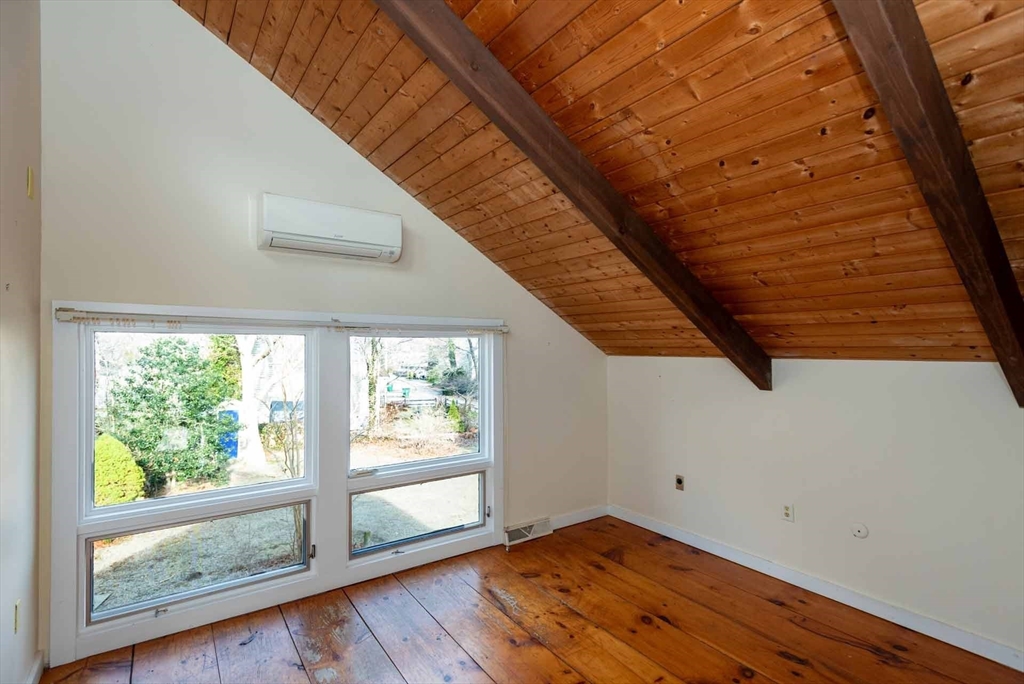 17 Chapman Lane Edgartown, MA 02539 - Photo 17 of 26 a view of an empty room with wooden floor and a window
