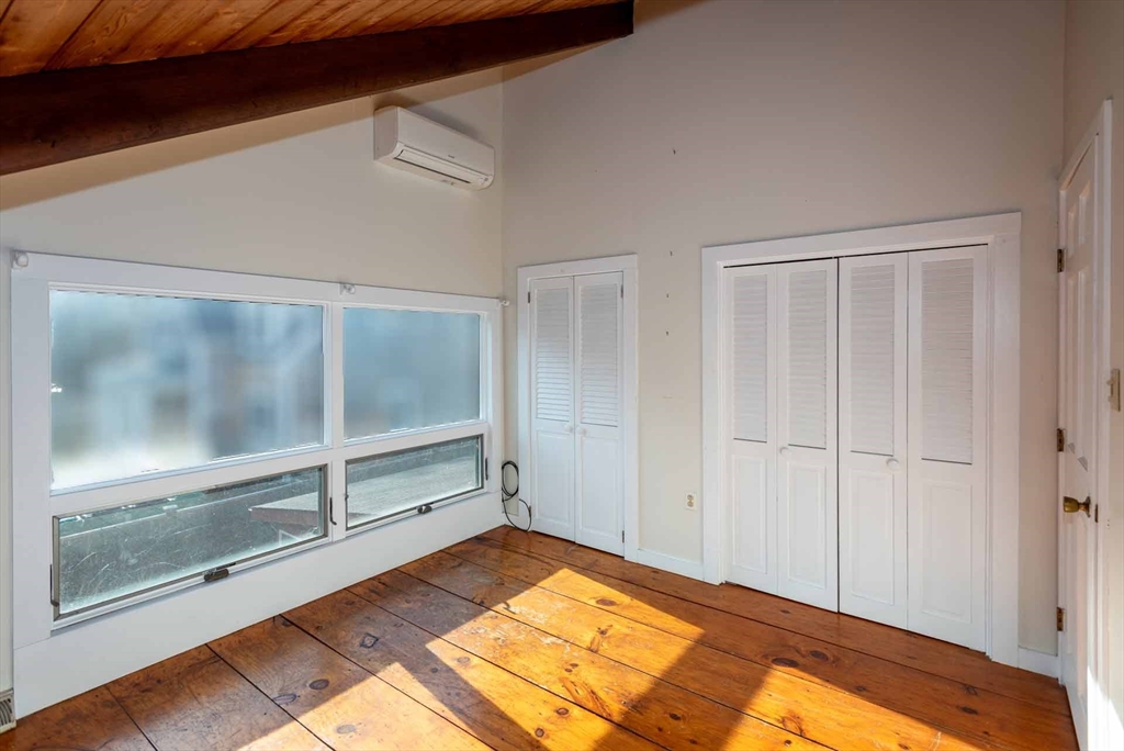 17 Chapman Lane Edgartown, MA 02539 - Photo 19 of 26 a view of a room with wooden floor and cabinet