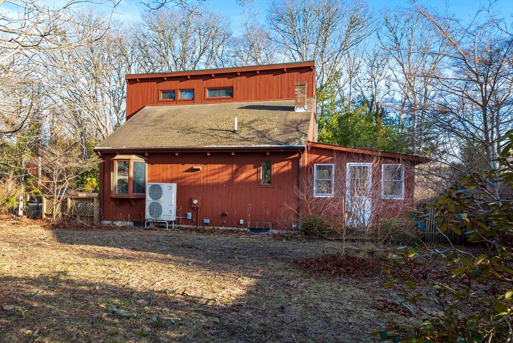 17 Chapman Lane Edgartown, MA 02539 - Photo 21 of 26 a front view of a house with large trees