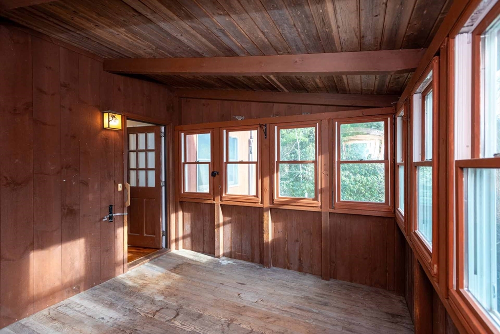 17 Chapman Lane Edgartown, MA 02539 - Photo 22 of 26 a view of empty room with wooden floor and fan