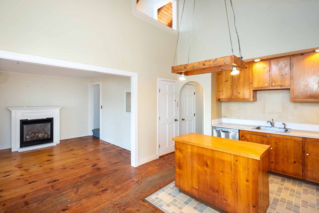 17 Chapman Lane Edgartown, MA 02539 - Photo 5 of 26 a kitchen with a sink a stove and a refrigerator