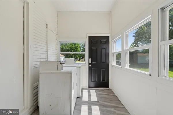 a view of bathroom with a sink and mirror