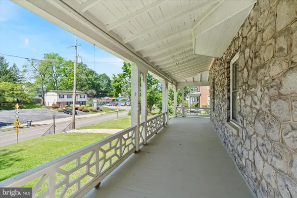 a view of a porch and garden