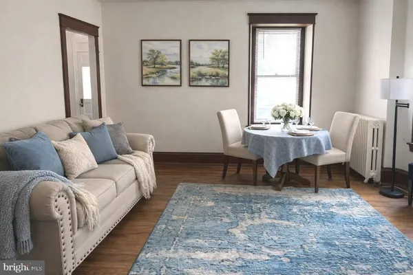 a living room with furniture and a rug