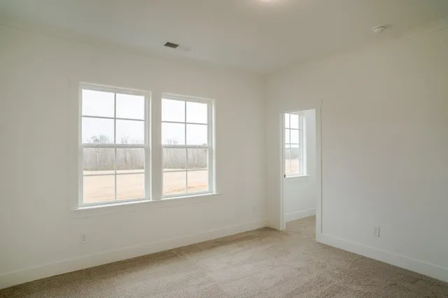 an empty room with windows
