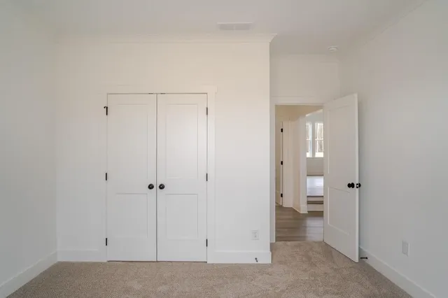 wooden view of a bathroom with a shower and a sink