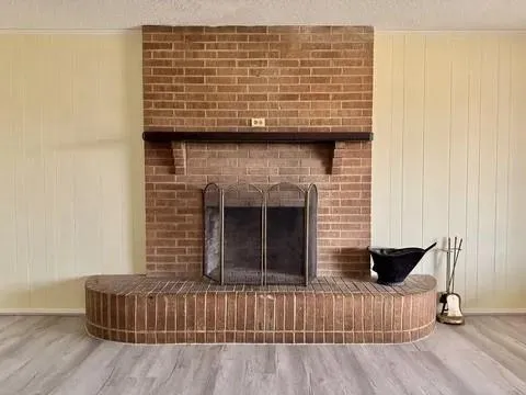 a view of a fireplace with wooden floor
