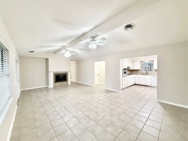 a view of livingroom with kitchen island hardwood floor and a sink
