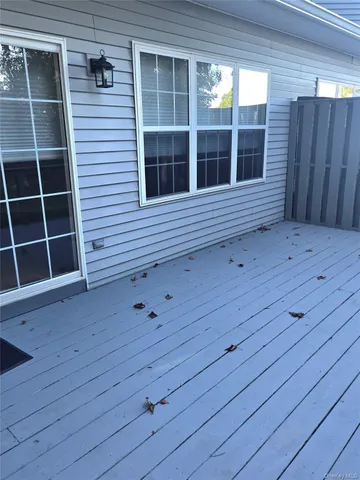 a view of front door and wooden floor