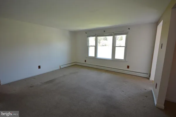 wooden floor and window in an empty room
