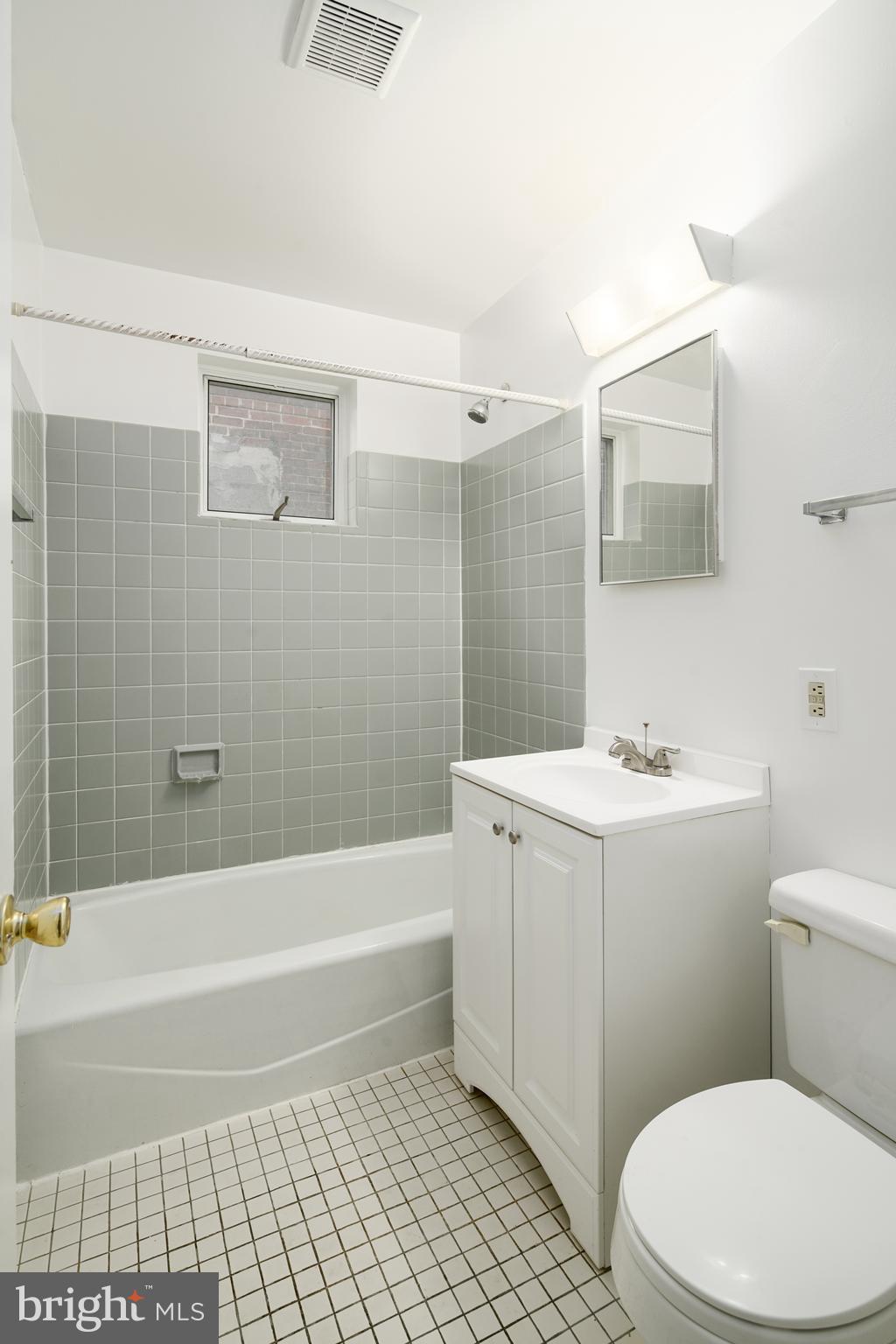 2338 South Broad Street Philadelphia, PA 19145 - Photo 7 of 7 a bathroom with a sink a toilet and shower