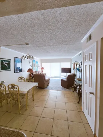 a bedroom with furniture and a large window