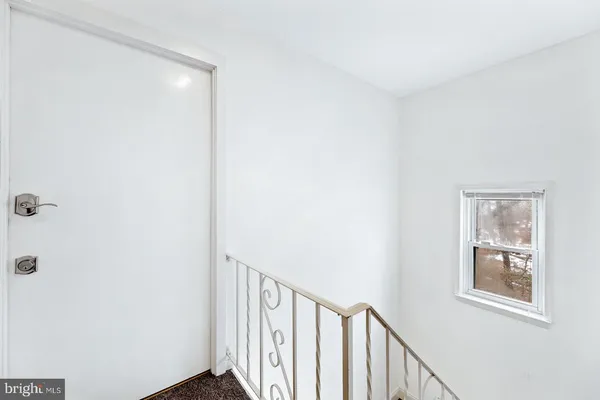 a view of a hallway with windows