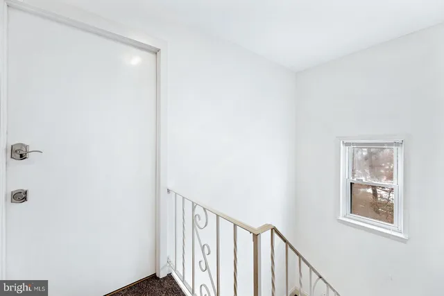 a view of a hallway with windows