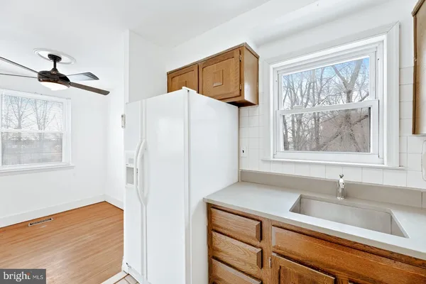 a bathroom with a sink and a window
