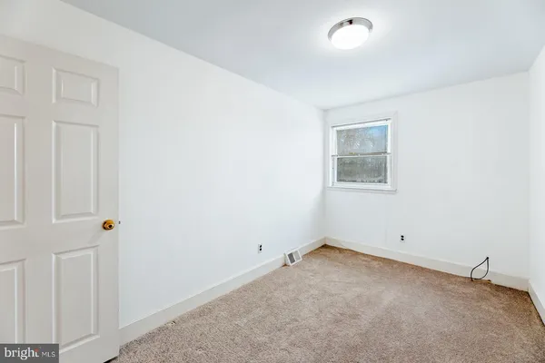 an empty room with a workbench