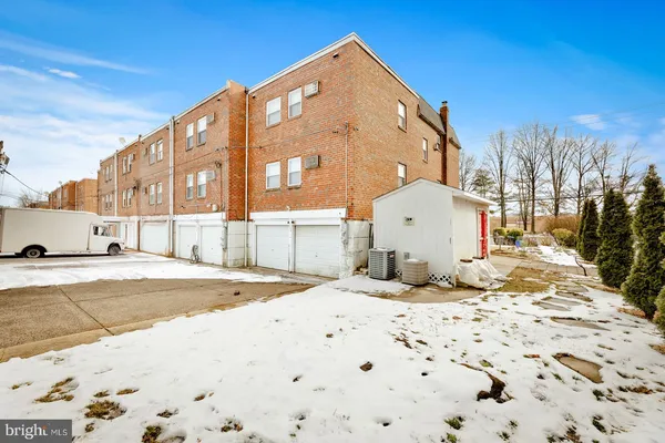 a large white building with a snow on the side of it
