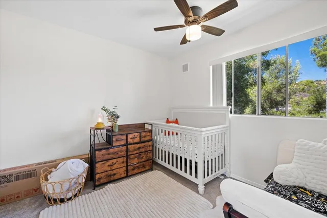 a bedroom with furniture and a window