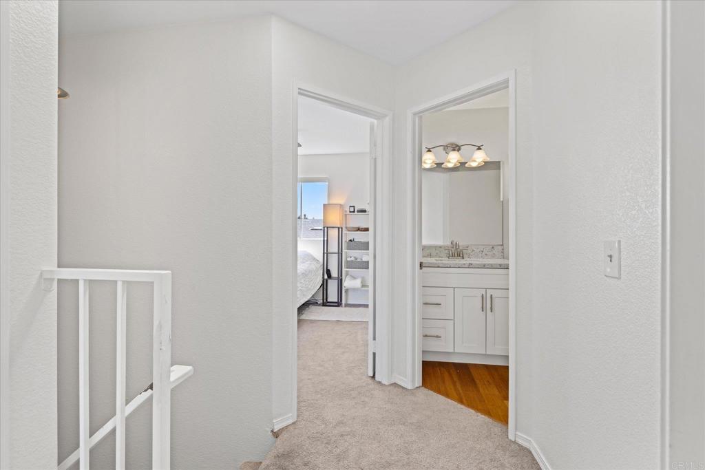 8166 Lemon Grove Way, Unit B Lemon Grove, CA 91945 - Photo 23 of 38 a hallway with cabinets and wooden floor