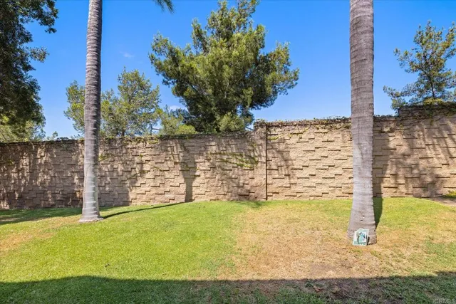 a view of yard with swimming pool