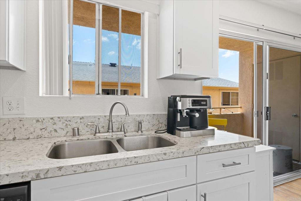 8166 Lemon Grove Way, Unit B Lemon Grove, CA 91945 - Photo 9 of 38 a kitchen with a sink and cabinets