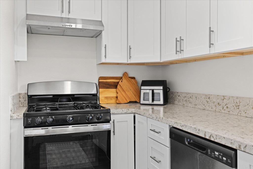 8166 Lemon Grove Way, Unit B Lemon Grove, CA 91945 - Photo 10 of 38 a kitchen with granite countertop stainless steel appliances and white cabinets