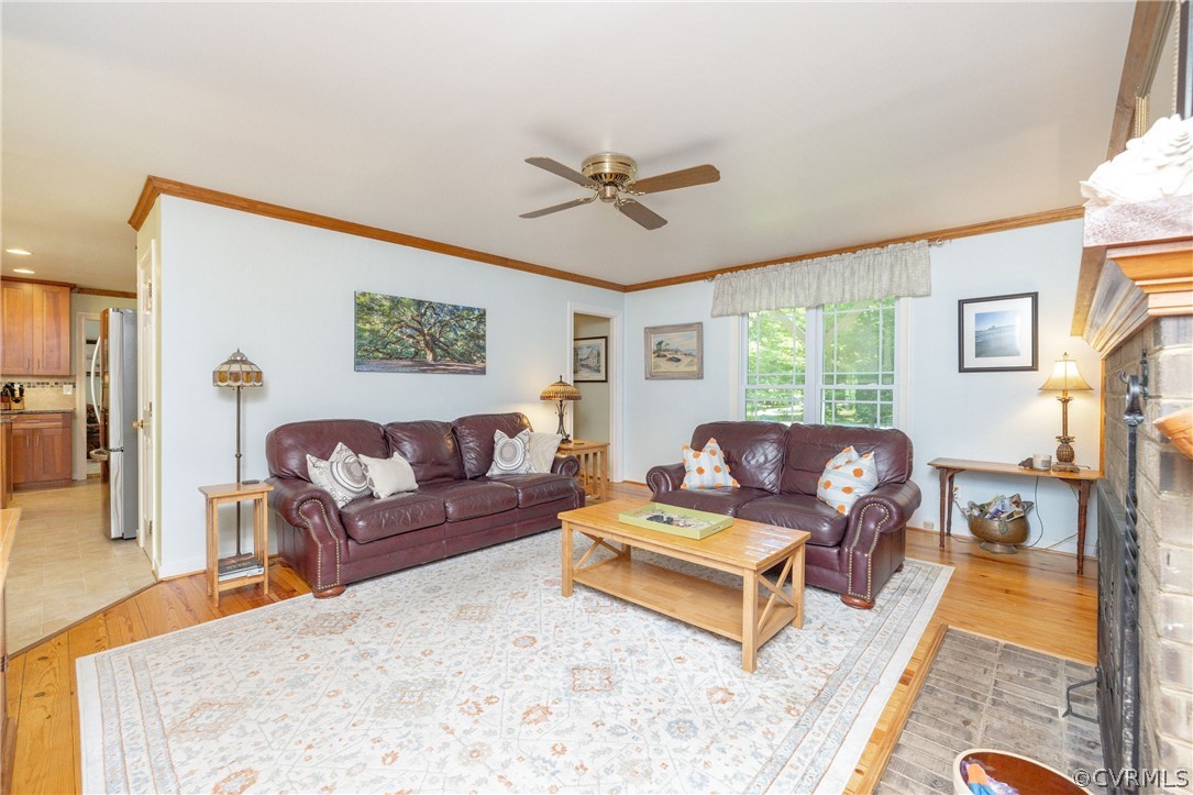 5421 Hunters Trail Road Goochland, VA 23063 - Photo 11 of 50 a living room with furniture and a fireplace