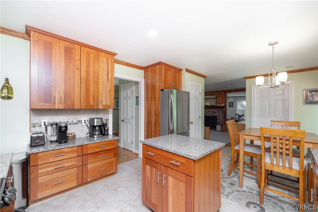 5421 Hunters Trail Road Goochland, VA 23063 - Photo 18 of 50 a kitchen with stainless steel appliances granite countertop a sink and a refrigerator