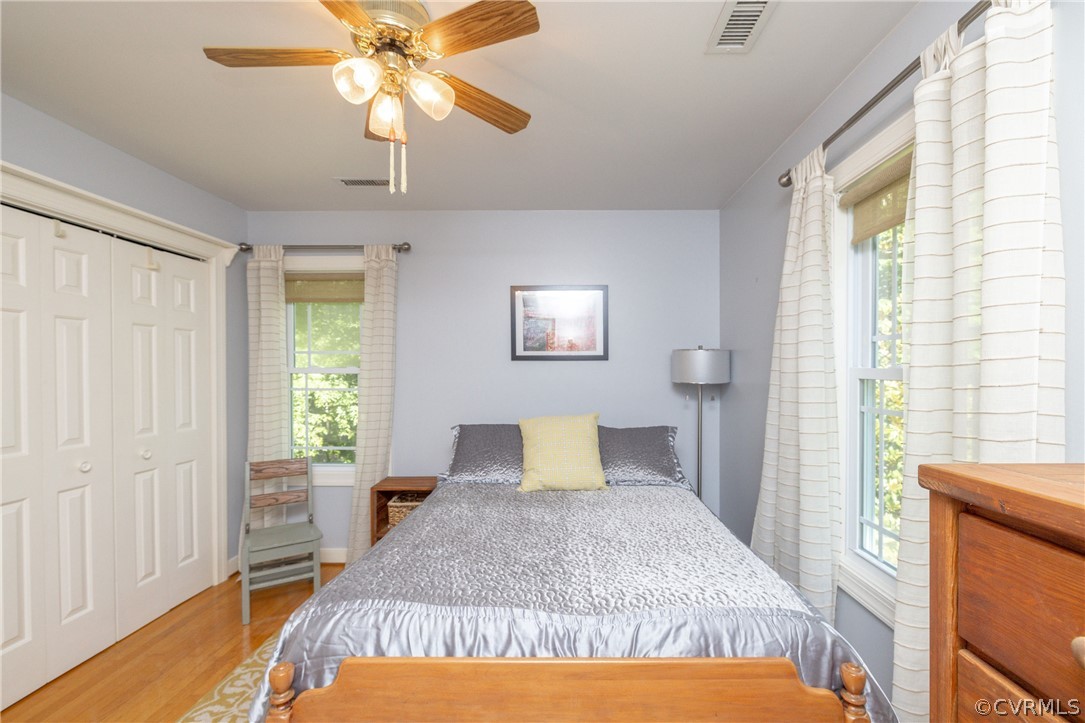 5421 Hunters Trail Road Goochland, VA 23063 - Photo 30 of 50 a bedroom with a bed and a chandelier