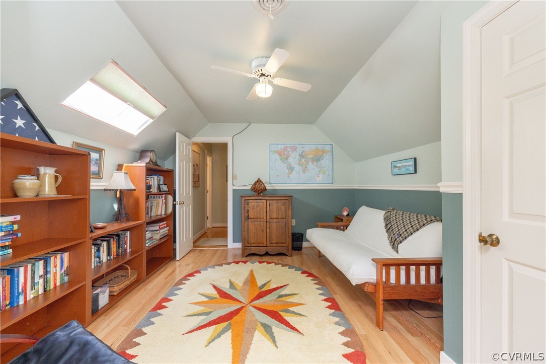 5421 Hunters Trail Road Goochland, VA 23063 - Photo 38 of 50 a living room with furniture and a book shelf