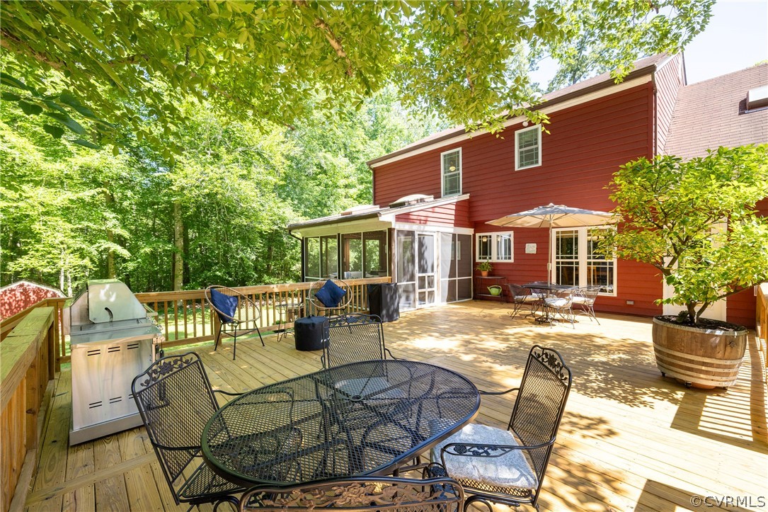 5421 Hunters Trail Road Goochland, VA 23063 - Photo 44 of 50 a view of a patio with table and chairs and wooden fence